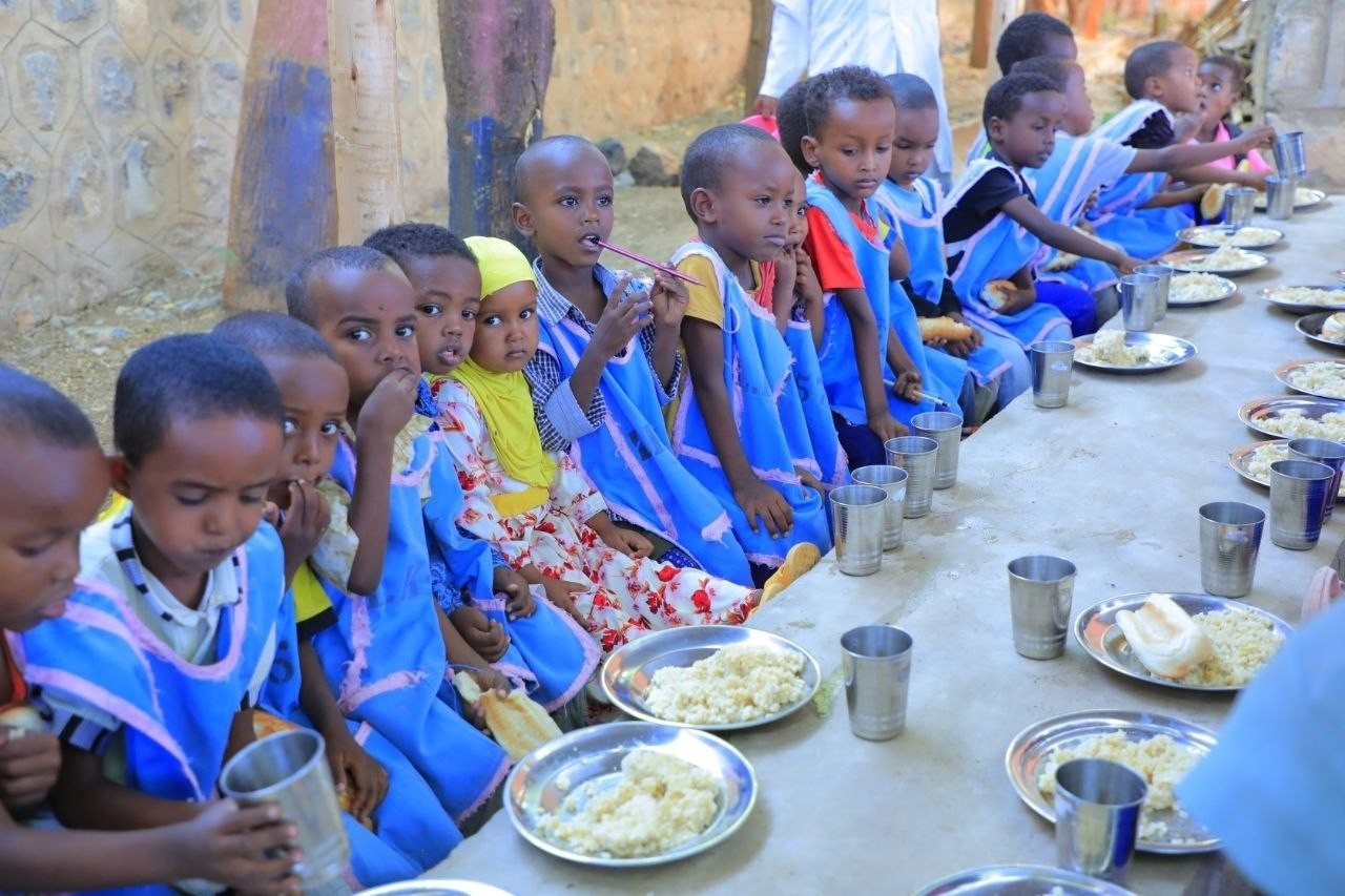 Children gathered during an ESMI school activity